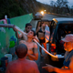 People bathe in and collect water piped from a creek in the mountains, in Naranjito, Puerto Rico, Thursday, Sept. 28, 2017. Image via the AP.